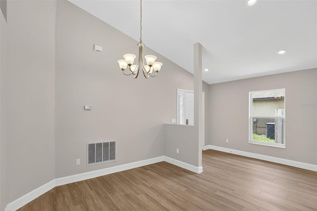 632 Bridge Creek Blvd, Ocoee, FL 34761 - unfurnished room featuring wood finished floors, a chandelier, high vaulted ceiling, and recessed lighting