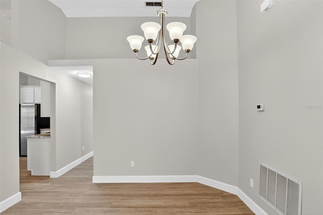 632 Bridge Creek Blvd, Ocoee, FL 34761 - spare room featuring a chandelier and light wood-style flooring