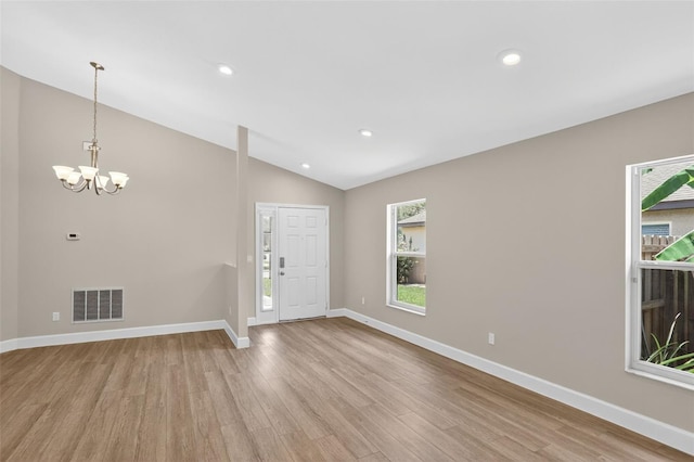 632 Bridge Creek Blvd, Ocoee, FL 34761 - foyer entrance featuring light wood-style flooring, plenty of natural light, vaulted ceiling, a chandelier, and recessed lighting