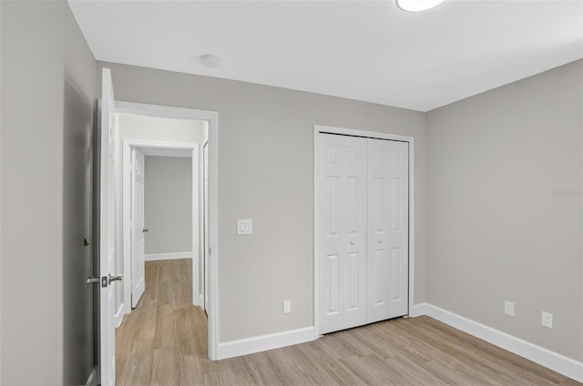 632 Bridge Creek Blvd, Ocoee, FL 34761 - unfurnished bedroom with light wood-style floors and a closet