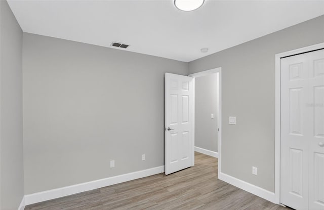 632 Bridge Creek Blvd, Ocoee, FL 34761 - unfurnished bedroom featuring light wood-style flooring and a closet