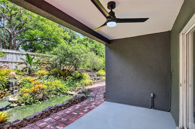 632 Bridge Creek Blvd, Ocoee, FL 34761 - view of patio / terrace with a ceiling fan and a small pond