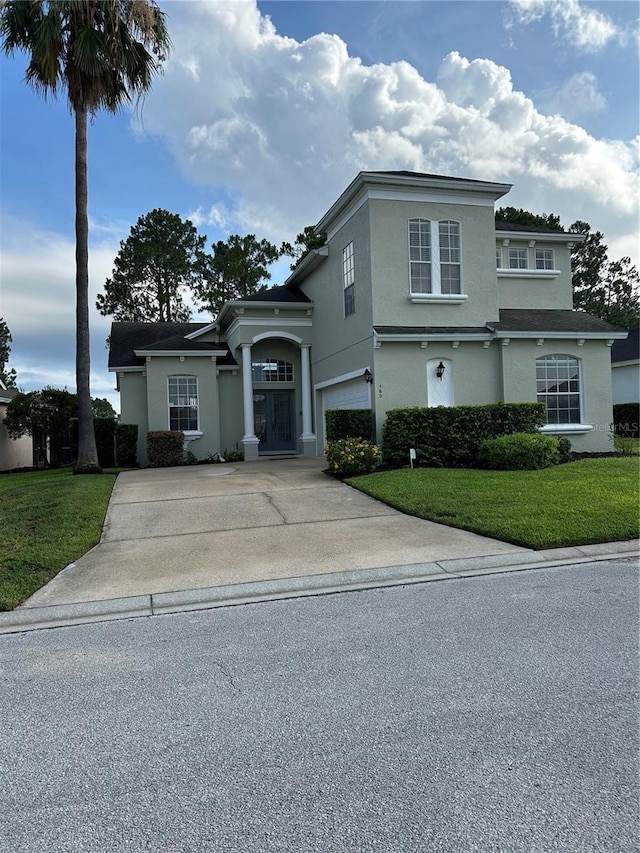 160 Calabay Parc Blvd, Davenport, FL 33897 - view of front of property with driveway, a front lawn, and stucco siding