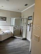 160 Calabay Parc Blvd, Davenport, FL 33897 - full bathroom featuring crown molding and a shower stall