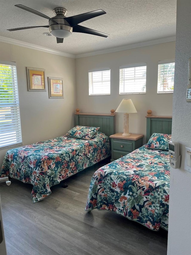 160 Calabay Parc Blvd, Davenport, FL 33897 - bedroom featuring wood finished floors, a textured ceiling, crown molding, and a ceiling fan