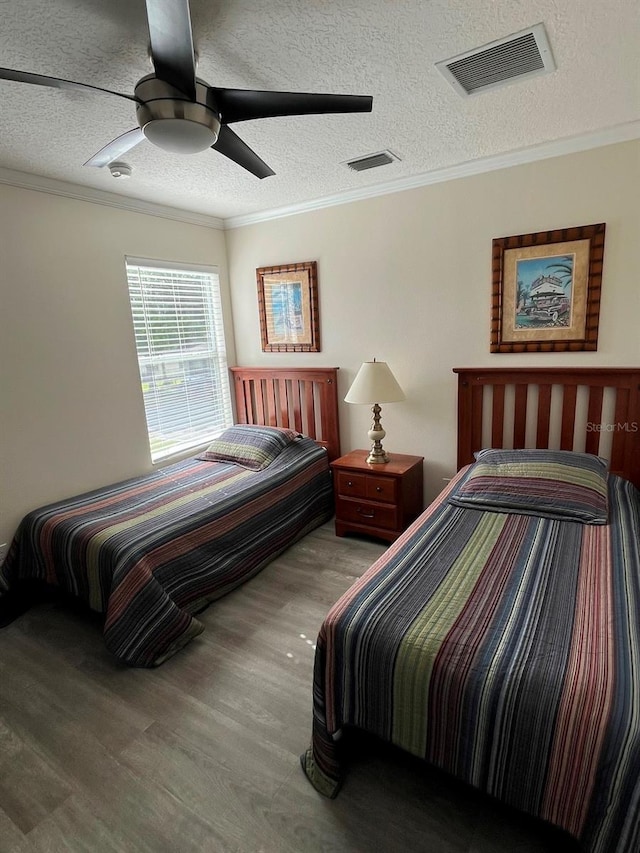 160 Calabay Parc Blvd, Davenport, FL 33897 - bedroom featuring wood finished floors, crown molding, a textured ceiling, and a ceiling fan