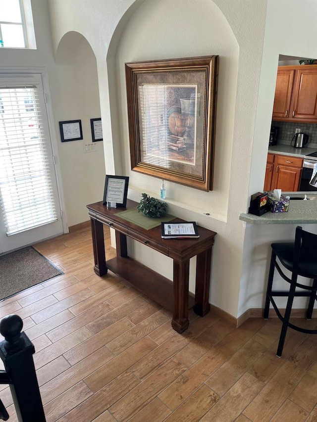 160 Calabay Parc Blvd, Davenport, FL 33897 - hall featuring light wood-type flooring and arched walkways