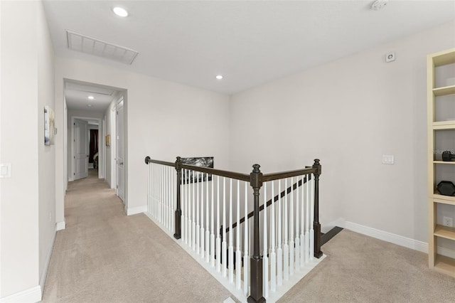 1787 White Feather Loop, Oakland, FL 34787 - corridor featuring light colored carpet, an upstairs landing, baseboards, and recessed lighting