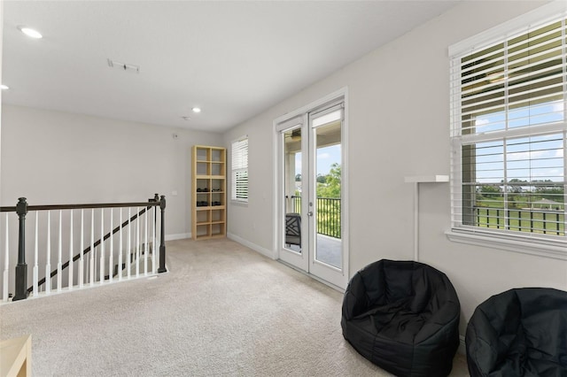 1787 White Feather Loop, Oakland, FL 34787 - sitting room featuring an upstairs landing, plenty of natural light, carpet floors, recessed lighting, and baseboards