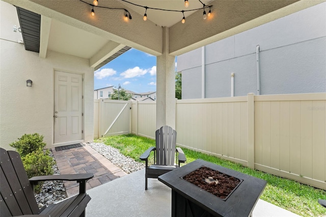 1787 White Feather Loop, Oakland, FL 34787 - view of patio featuring a fire pit and a gate