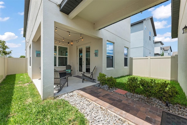 1787 White Feather Loop, Oakland, FL 34787 - fenced backyard featuring french doors and a patio
