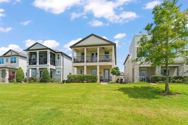 1787 White Feather Loop, Oakland, FL 34787 - view of front of home featuring ceiling fan, a front yard, stucco siding, and a balcony