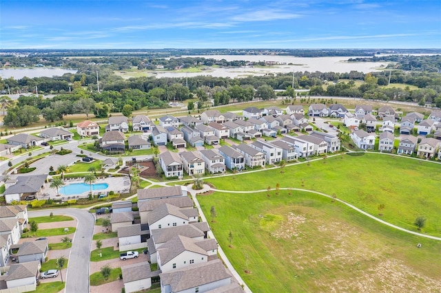 1787 White Feather Loop, Oakland, FL 34787 - aerial view of property's location with nearby suburban area, a nearby body of water, and a pool area
