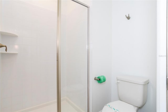 1070 Splash Shot Pl, Davenport, FL 33896 - bathroom featuring a stall shower and toilet