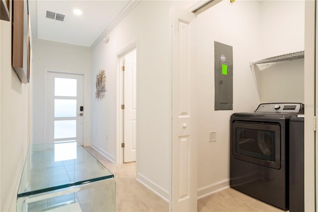 1070 Splash Shot Pl, Davenport, FL 33896 - laundry area with separate washer and dryer, electric panel, crown molding, baseboards, and light tile patterned floors