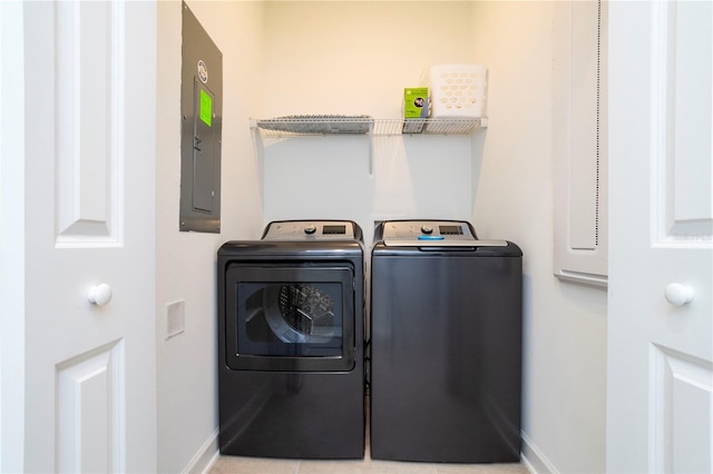 1070 Splash Shot Pl, Davenport, FL 33896 - laundry room with washer and clothes dryer, baseboards, and electric panel