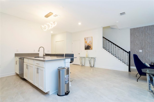 1070 Splash Shot Pl, Davenport, FL 33896 - kitchen with a sink, stainless steel dishwasher, white cabinetry, pendant lighting, and baseboards
