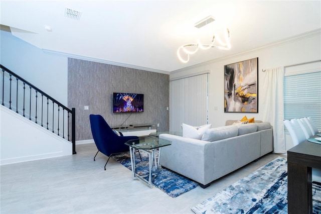 1070 Splash Shot Pl, Davenport, FL 33896 - living area with ornamental molding, an accent wall, stairway, and baseboards