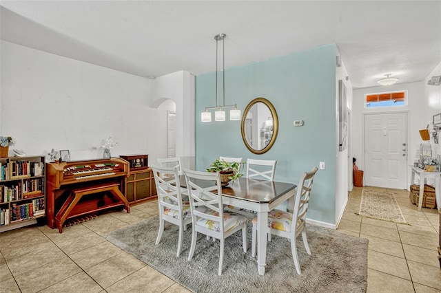 8152 Fan Palm Way, Kissimmee, FL 34747 - dining space with tile patterned floors and arched walkways