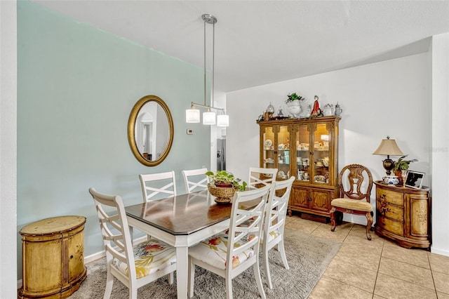 8152 Fan Palm Way, Kissimmee, FL 34747 - dining area with light tile patterned floors and baseboards