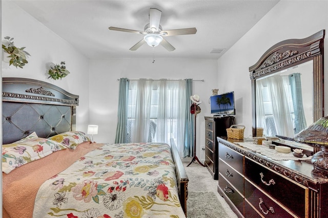 8152 Fan Palm Way, Kissimmee, FL 34747 - bedroom with light colored carpet and ceiling fan