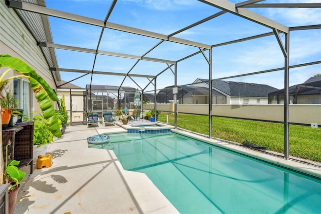 8152 Fan Palm Way, Kissimmee, FL 34747 - view of pool featuring a patio, glass enclosure, a pool with connected hot tub, a lawn, and a residential view