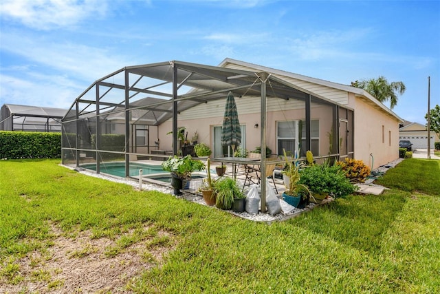 8152 Fan Palm Way, Kissimmee, FL 34747 - rear view of property featuring a lawn, a patio area, stucco siding, and an outdoor pool
