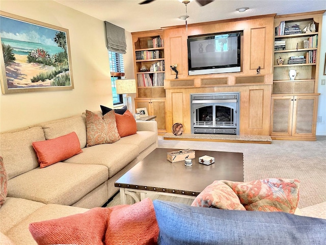 6836 Bittersweet Ln, Orlando, FL 32819 - living area featuring built in features, carpet flooring, and a fireplace with raised hearth