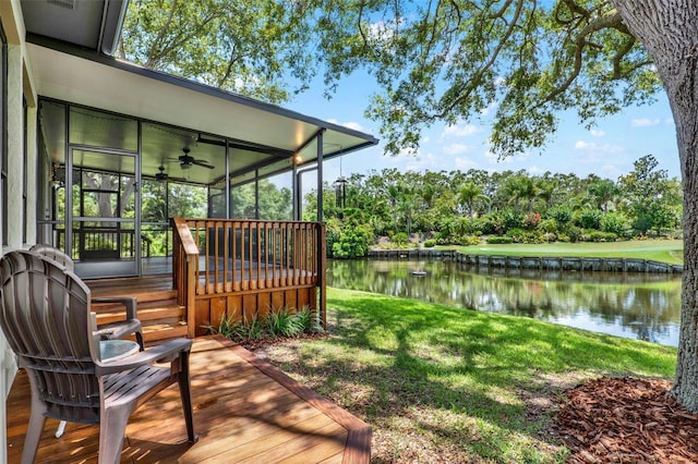 6836 Bittersweet Ln, Orlando, FL 32819 - wooden deck with a water view, a ceiling fan, view of wooded area, and a lawn