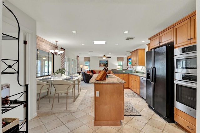 6836 Bittersweet Ln, Orlando, FL 32819 - kitchen with stainless steel appliances, open floor plan, plenty of natural light, a chandelier, and recessed lighting