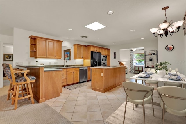 6836 Bittersweet Ln, Orlando, FL 32819 - kitchen with appliances with stainless steel finishes, open shelves, recessed lighting, a center island, and a chandelier