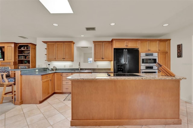 6836 Bittersweet Ln, Orlando, FL 32819 - kitchen featuring black appliances, open shelves, a peninsula, light tile patterned floors, and recessed lighting