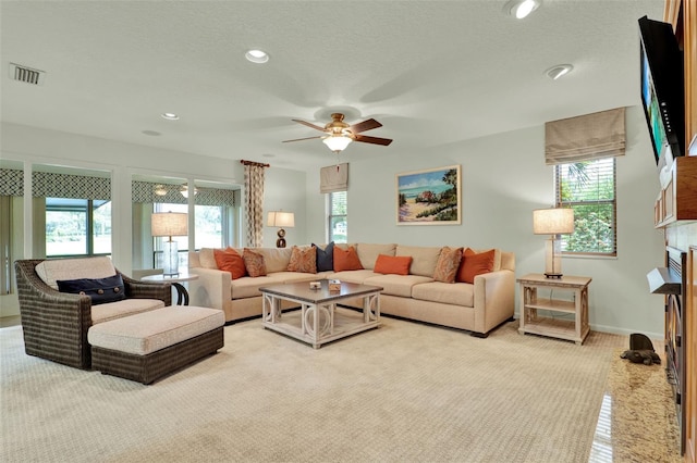 6836 Bittersweet Ln, Orlando, FL 32819 - living room featuring ceiling fan, light colored carpet, and recessed lighting