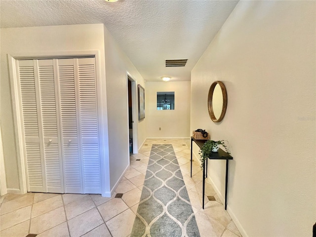 6836 Bittersweet Ln, Orlando, FL 32819 - hall featuring light tile patterned floors and a textured ceiling
