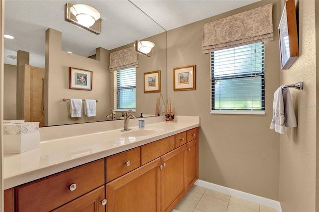 6836 Bittersweet Ln, Orlando, FL 32819 - bathroom featuring tile patterned flooring, vanity, and a shower