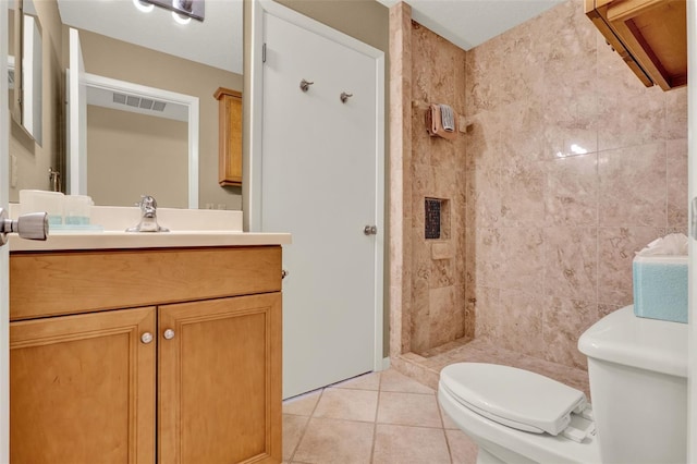 6836 Bittersweet Ln, Orlando, FL 32819 - bathroom featuring vanity, a tile shower, and tile patterned floors