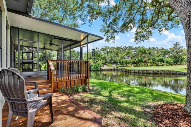 6836 Bittersweet Ln, Orlando, FL 32819 - deck with a water view, a ceiling fan, view of wooded area, a yard, and a sunroom