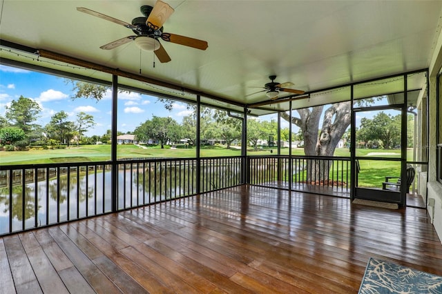 6836 Bittersweet Ln, Orlando, FL 32819 - unfurnished sunroom with ceiling fan, view of golf course, and a water view