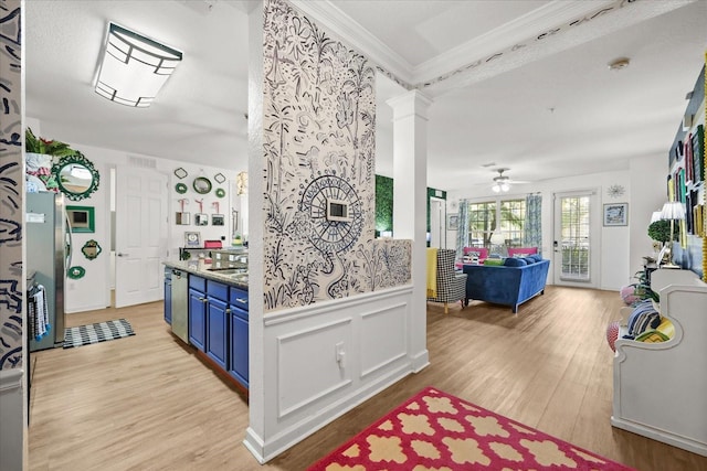 5012 Shoreway Loop Unit 10107, Orlando, FL 32819 - kitchen featuring blue cabinetry, ornamental molding, light wood finished floors, a ceiling fan, and appliances with stainless steel finishes