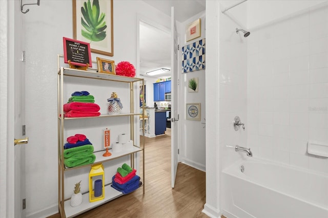 5012 Shoreway Loop Unit 10107, Orlando, FL 32819 - bathroom featuring  shower combination and wood finished floors