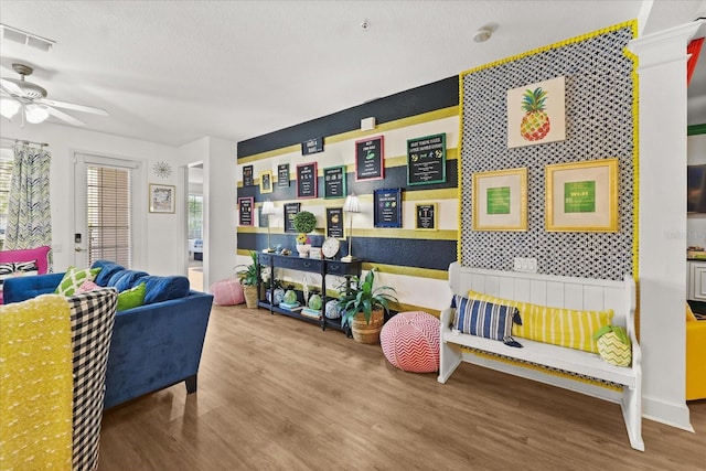 5012 Shoreway Loop Unit 10107, Orlando, FL 32819 - living room with wood finished floors and a ceiling fan