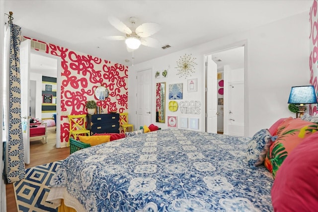 5012 Shoreway Loop Unit 10107, Orlando, FL 32819 - bedroom with wood finished floors and ceiling fan