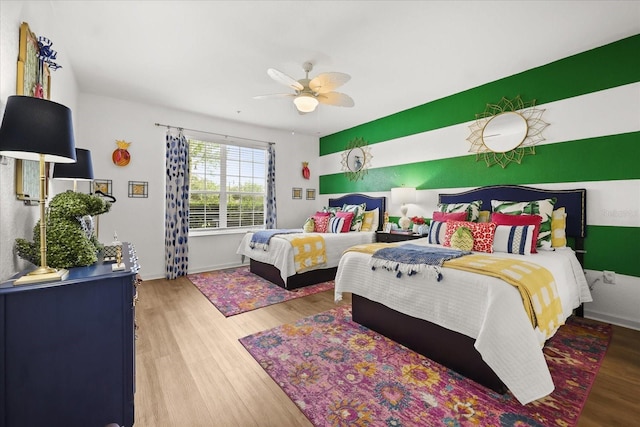 5012 Shoreway Loop Unit 10107, Orlando, FL 32819 - bedroom featuring wood finished floors, ceiling fan, and baseboards