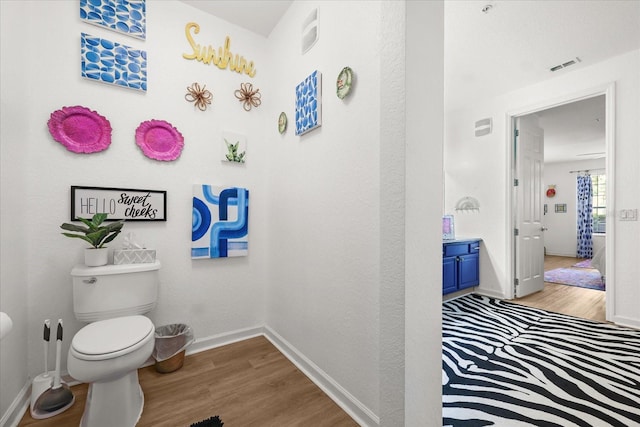 5012 Shoreway Loop Unit 10107, Orlando, FL 32819 - bathroom with toilet, wood finished floors, baseboards, and vanity