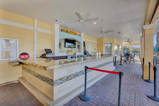 5012 Shoreway Loop Unit 10107, Orlando, FL 32819 - view of patio / terrace with exterior kitchen and ceiling fan