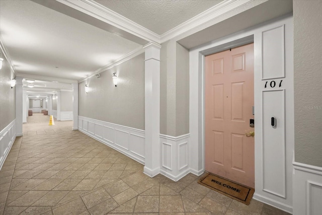 5012 Shoreway Loop Unit 10107, Orlando, FL 32819 - foyer entrance featuring a decorative wall, ornamental molding, and wainscoting