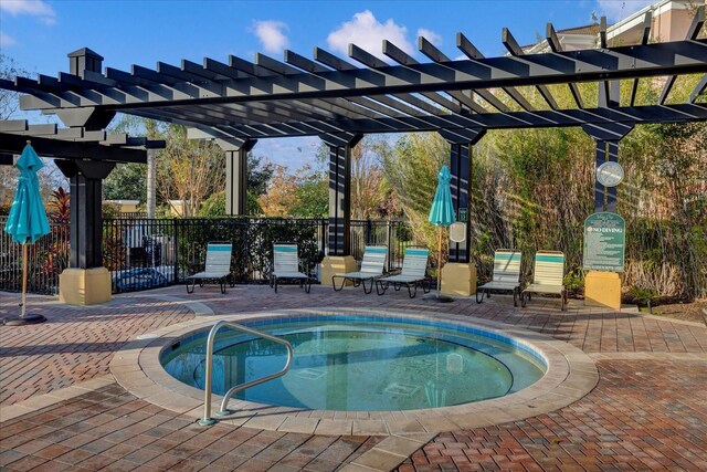 5012 Shoreway Loop Unit 10107, Orlando, FL 32819 - view of swimming pool featuring a pergola, a swimming pool, a patio area, and a hot tub