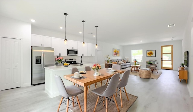 2486 W Magenta Dr, Citrus Springs, FL 34434 - dining room featuring light wood-style floors and recessed lighting