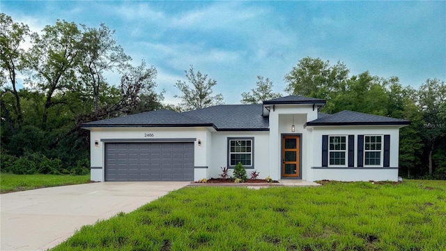 2486 W Magenta Dr, Citrus Springs, FL 34434 - prairie-style house featuring an attached garage, concrete driveway, a front yard, and stucco siding
