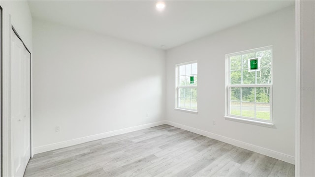 2486 W Magenta Dr, Citrus Springs, FL 34434 - unfurnished bedroom featuring light wood-style floors and recessed lighting